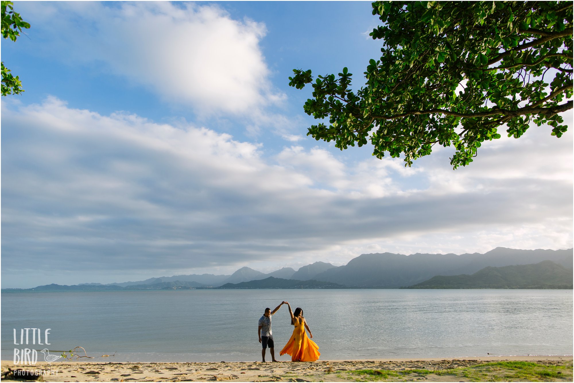 couple at kualoa beach with views of kaneohe bay