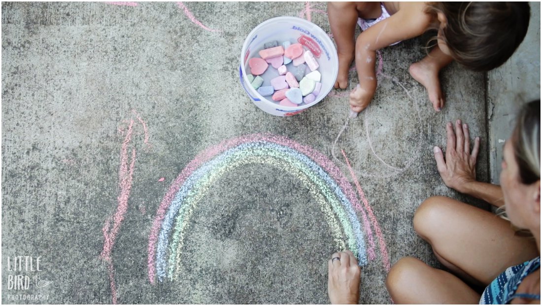 mom and daughter making a chalk rainbow in Documentary Family Film