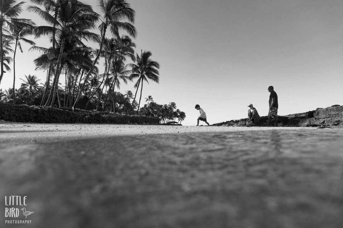 family playing at ko olina lagoon oahu black and white photo by Little Bird Photography