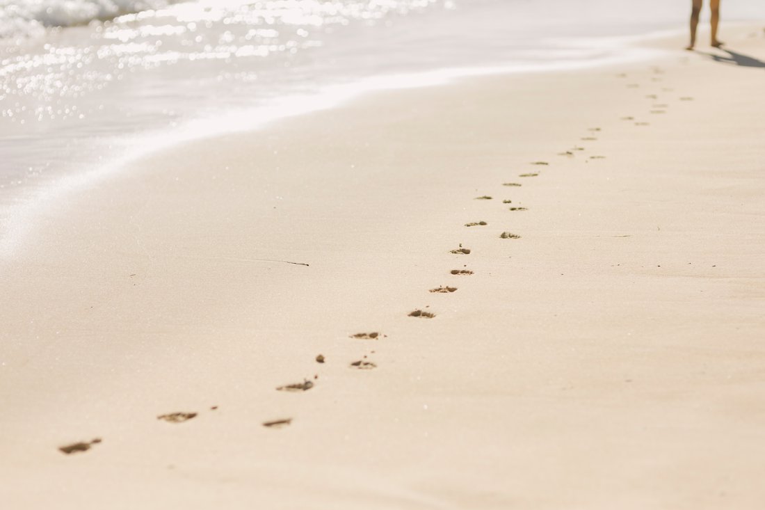 footprints in the sand at lanikai beach