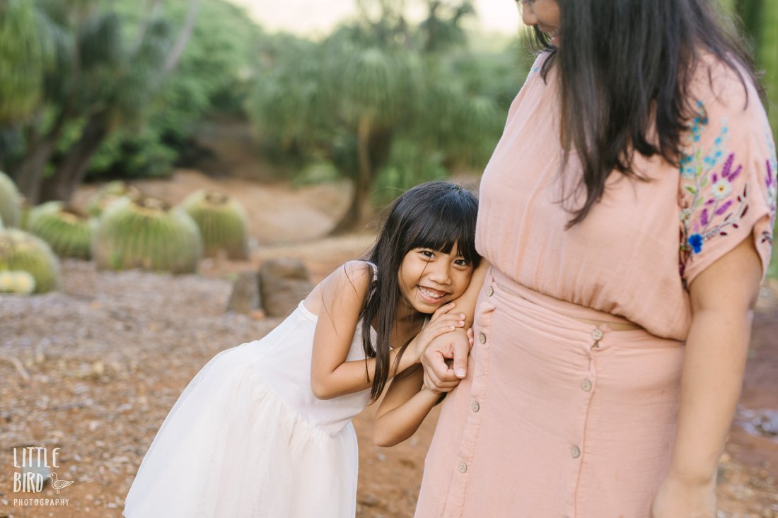 mom and daughter play during family photoshoot by little bird photography