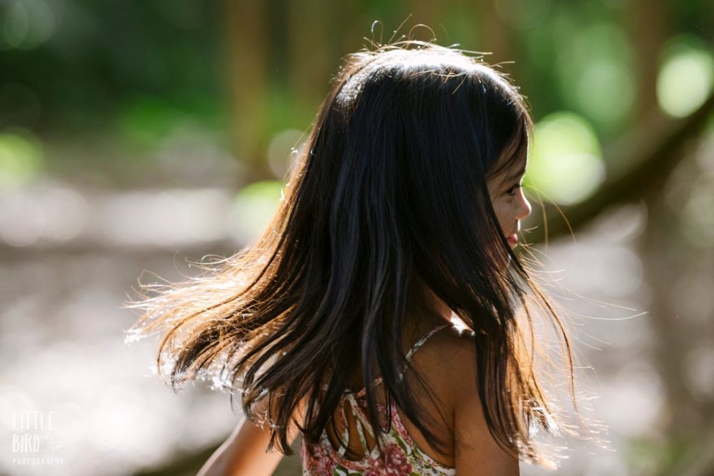 closeup of girl spinning in the forest
