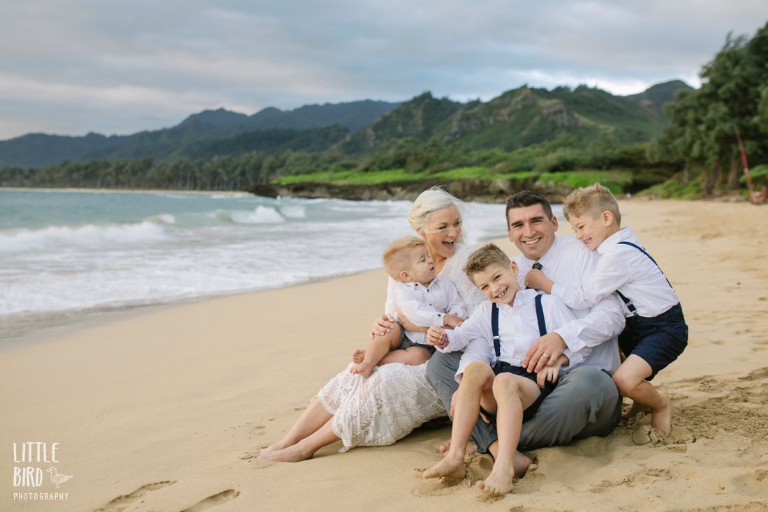 family cuddles during hawaii photo shoot