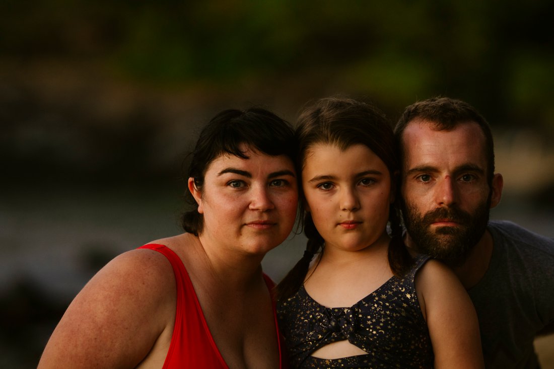 a serious family portrait at sunset