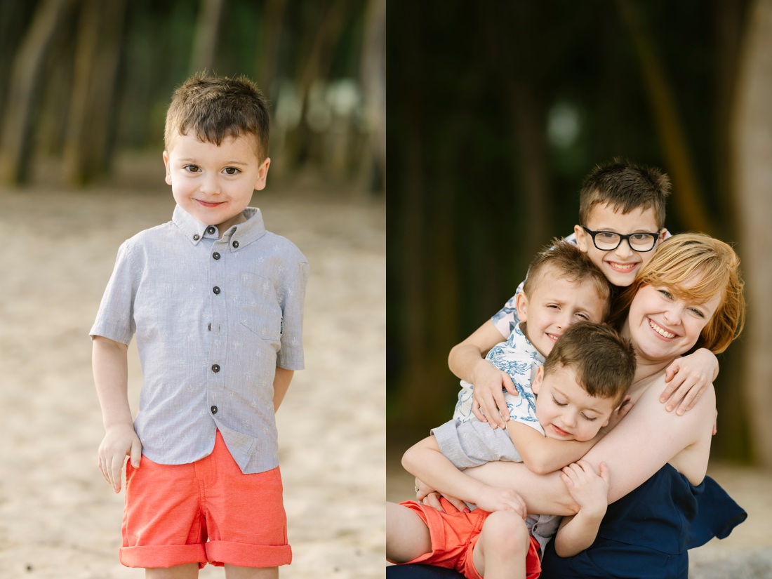 Mom snuggling her three boys during a beach photo shoot in hawaii