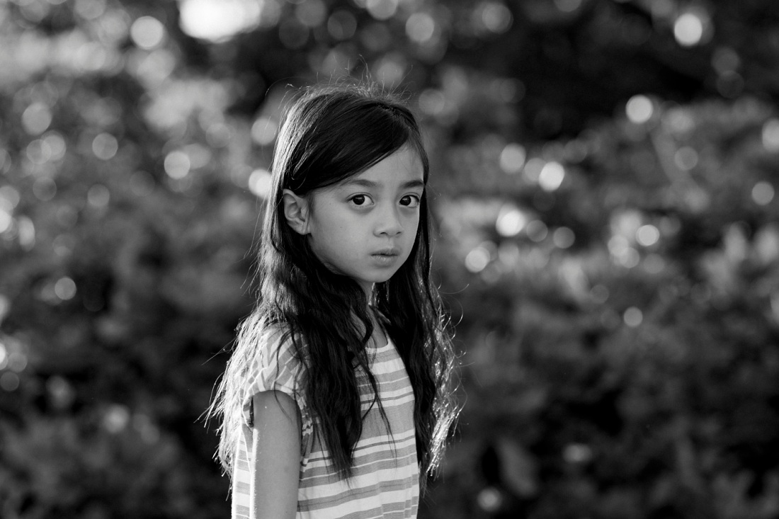 black and white portrait of a girl at laie beach park