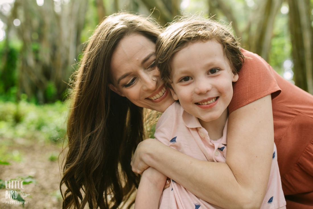 mom hugging son during a family photo session by little bird photography