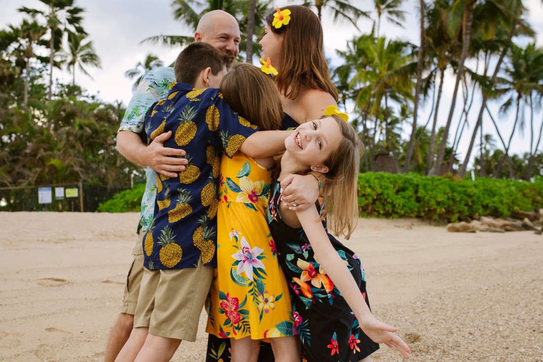 family hug during a photo session in hawaii