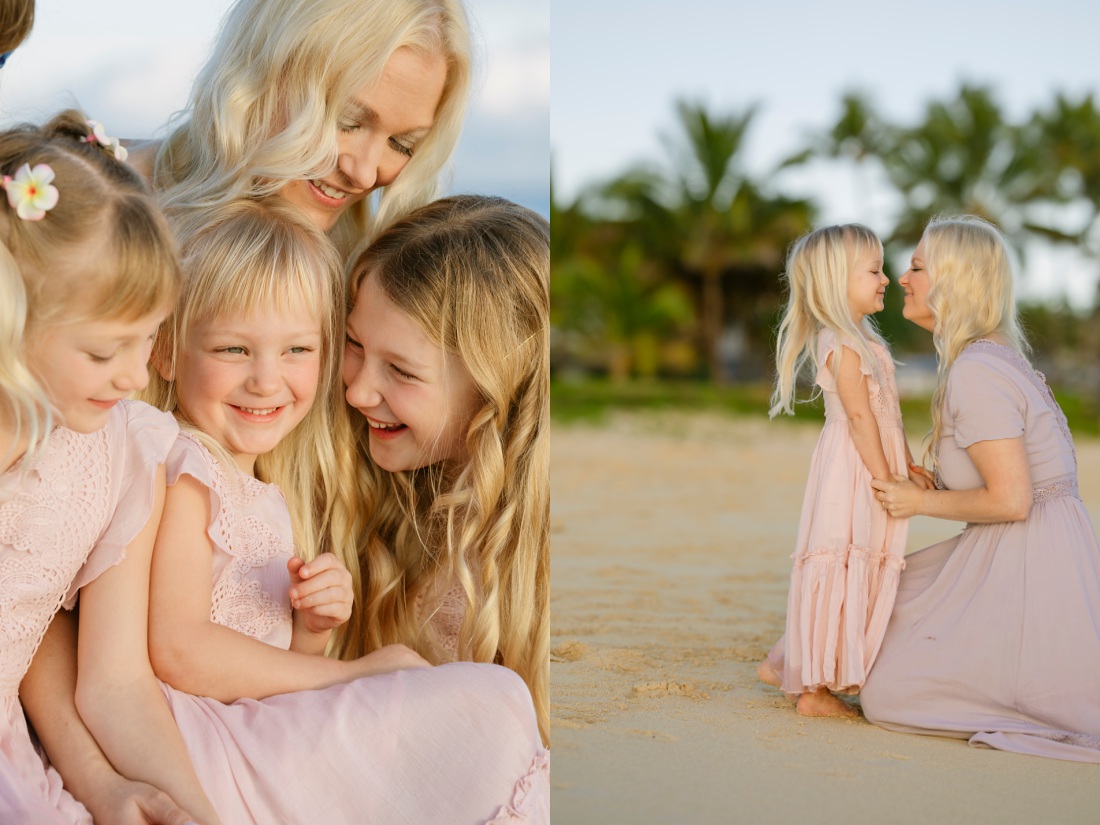 mom and daughters sharing a laugh on the beach at sunrise