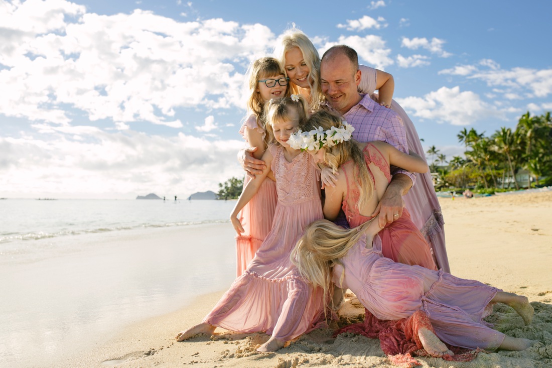 a sloppy family hug at the beach in hawaii