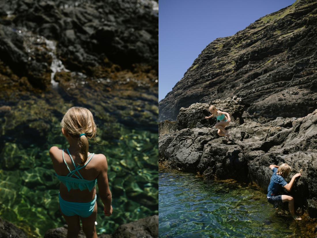 kids jumping from rocks into deep tide pools at makapuu on oahu