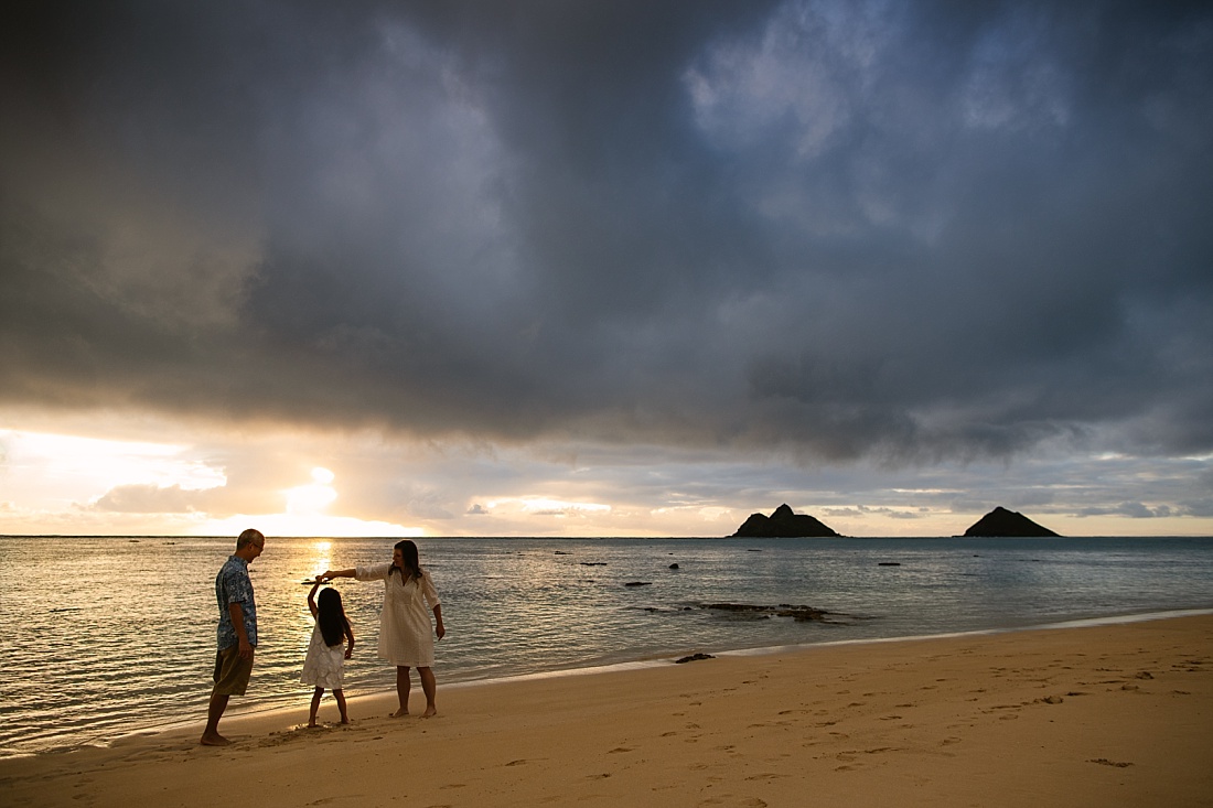 family portrait during a moody sunrise over lanikai beach