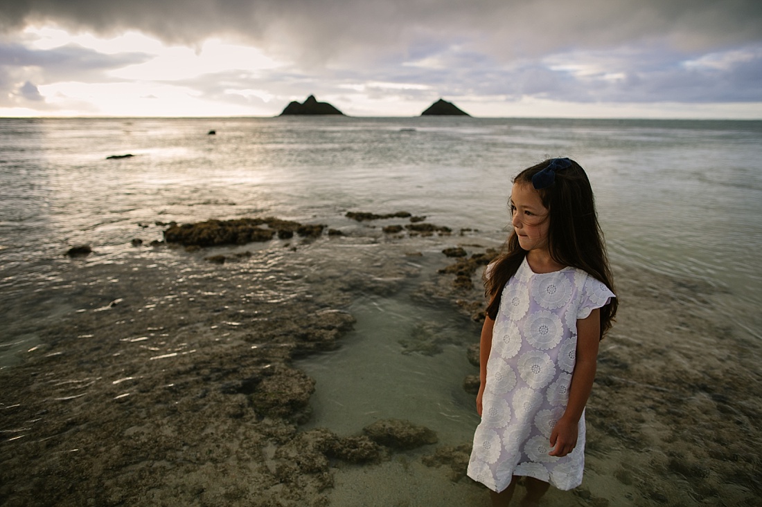 portrait of a girl with the mokuluas behind by lanikai family photographer little bird photography