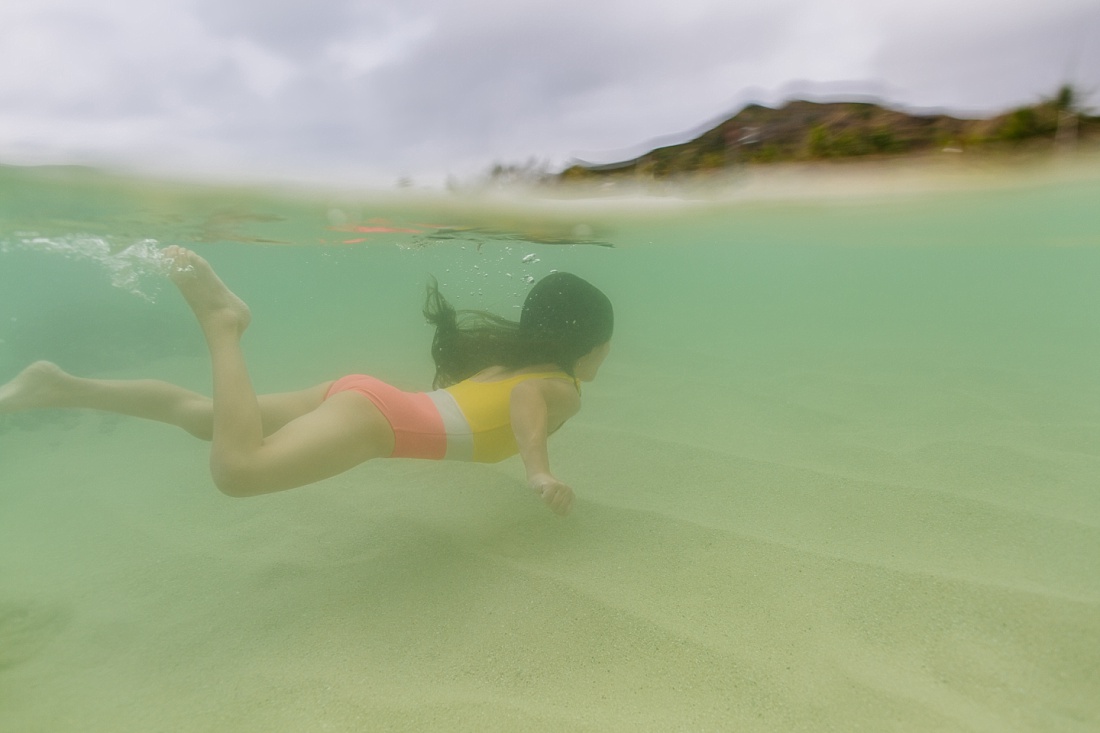 underwater portrait of a girl swimming at lanikai beach oahu