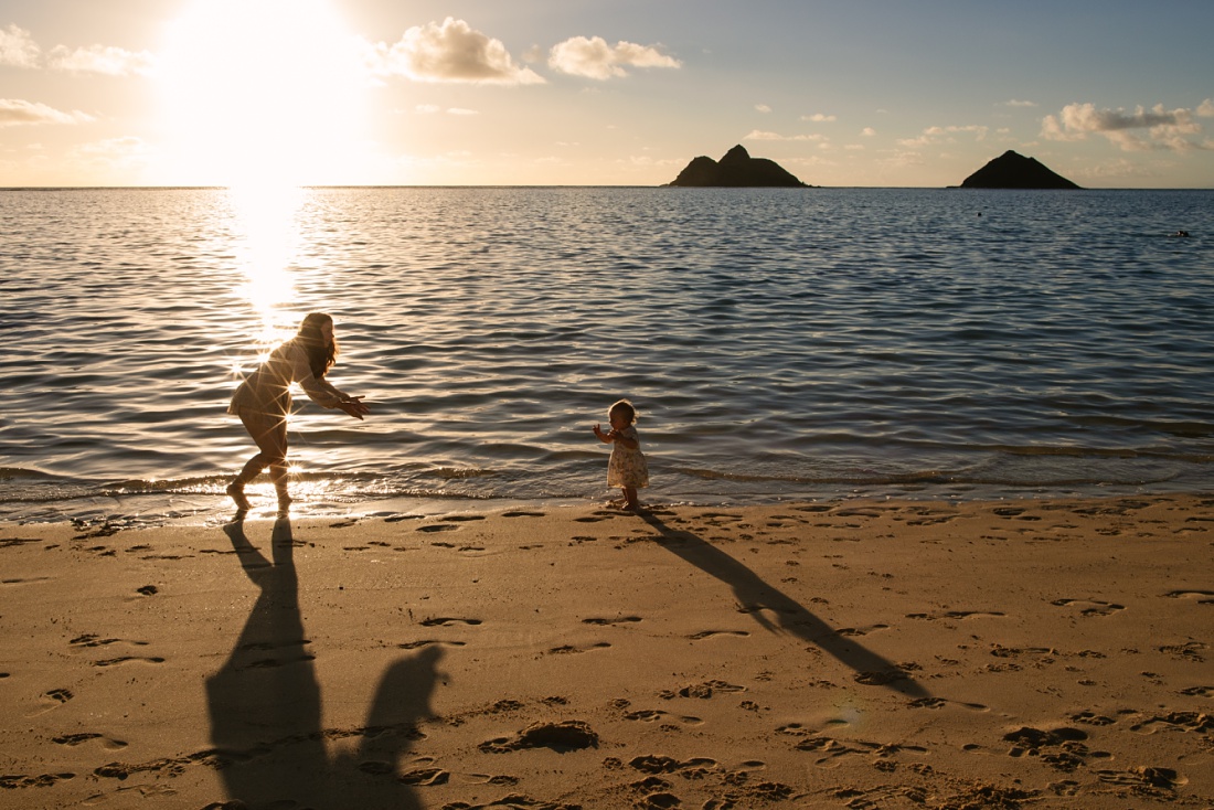 baby learning to walk at lanikai beach oahu during a photoshoot by little bird photography