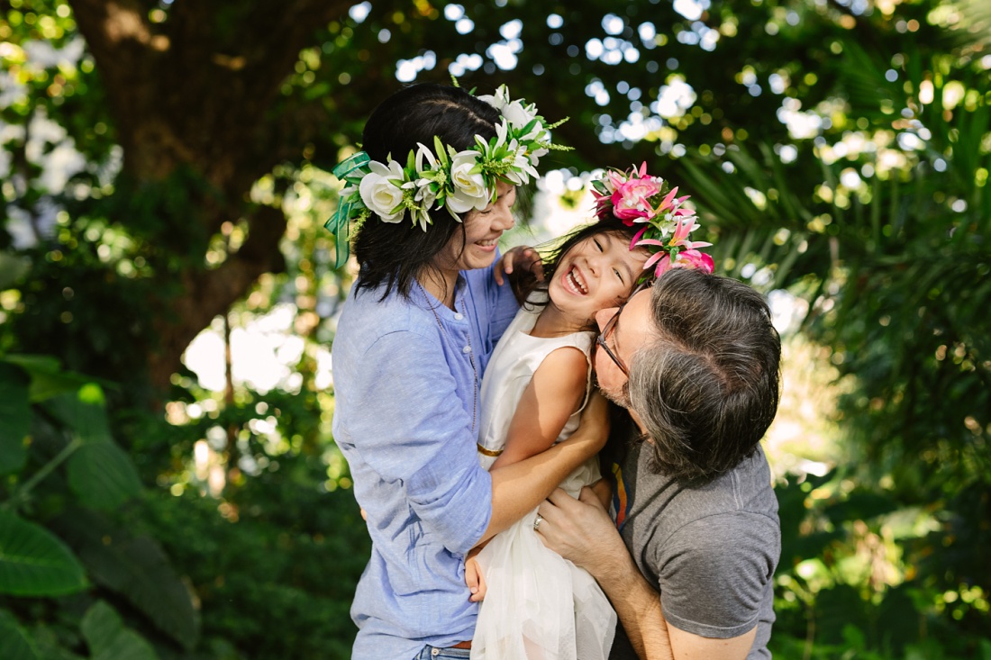 a family shares a big hug during a session by a family videographer hawaii