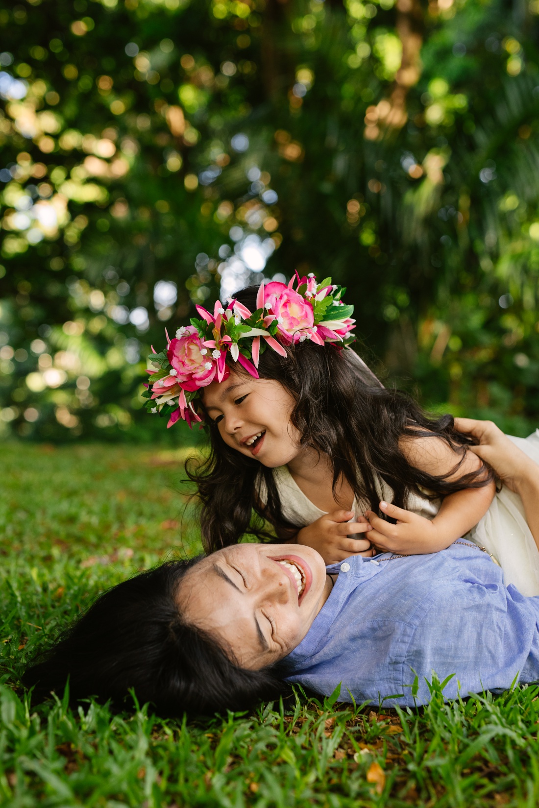 mom and daughter laughing during a family photo session by little bird photography