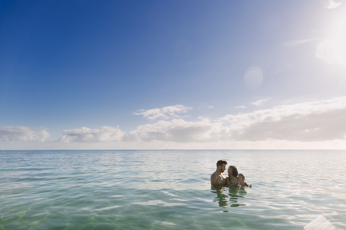 family photos in the water at lanikai beach hawaii