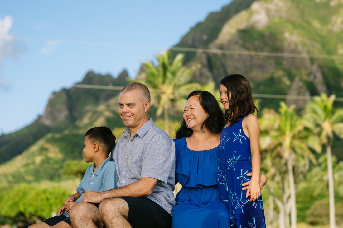 family portrait with mountains behind at kualoa park
