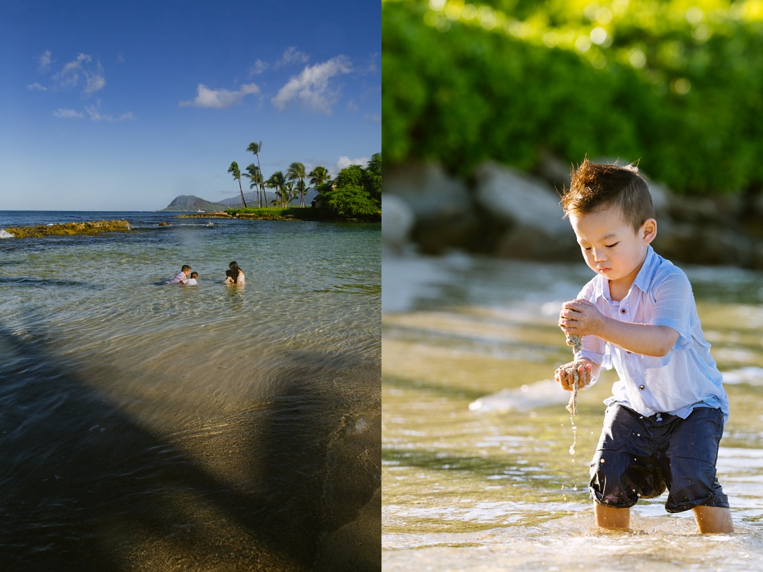 boy playing in the shallow water of paradise cove in koolina