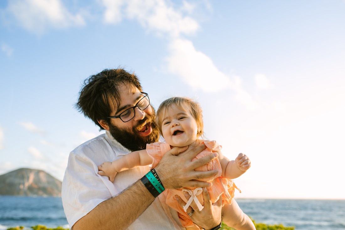 fun picture of dad and laughing baby at Makapuu, Oahu