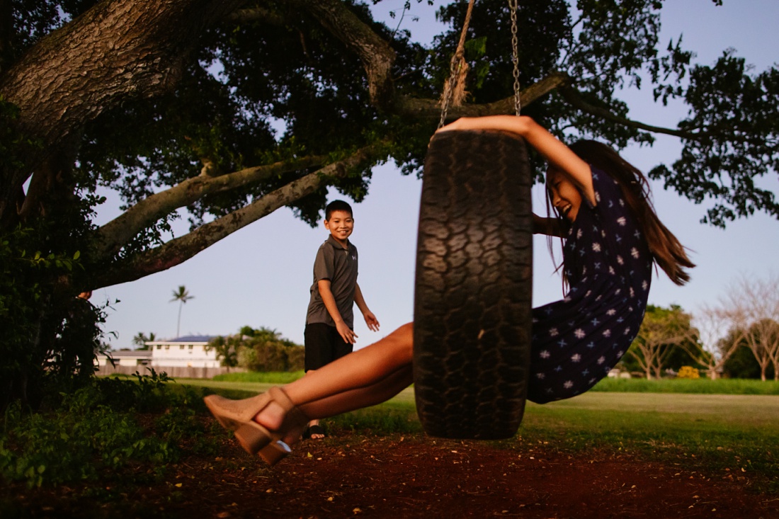 kids play on a tire swing at kaha park in kailua
