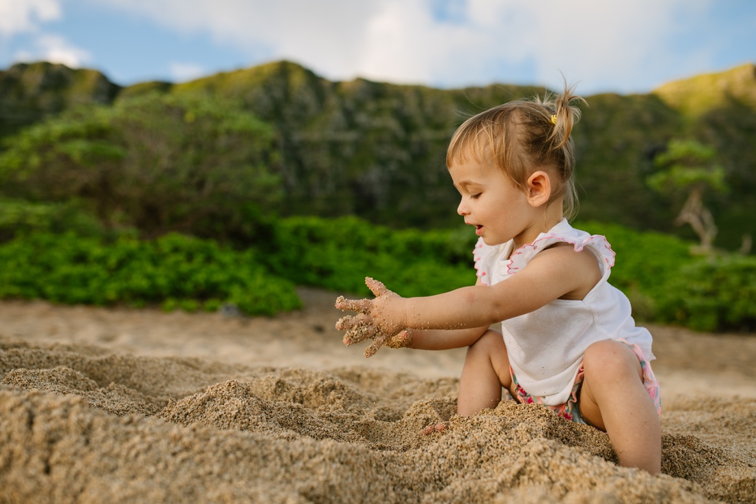 toddler playing in the sand