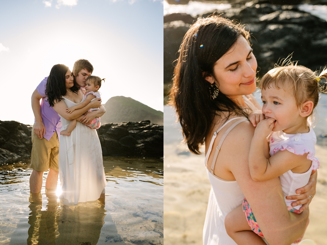 family snuggles close at the end of a sunrise photo session in hawaii