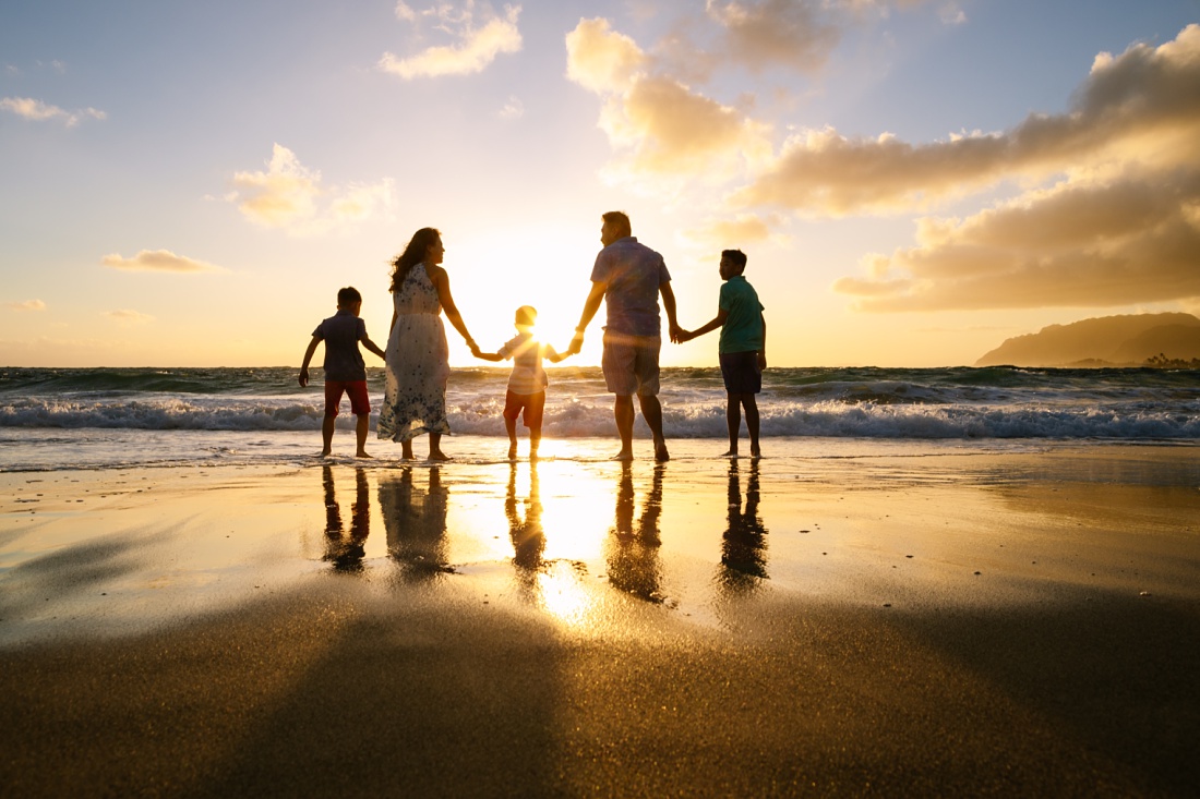 family beach portrait at sunrise in hawaii