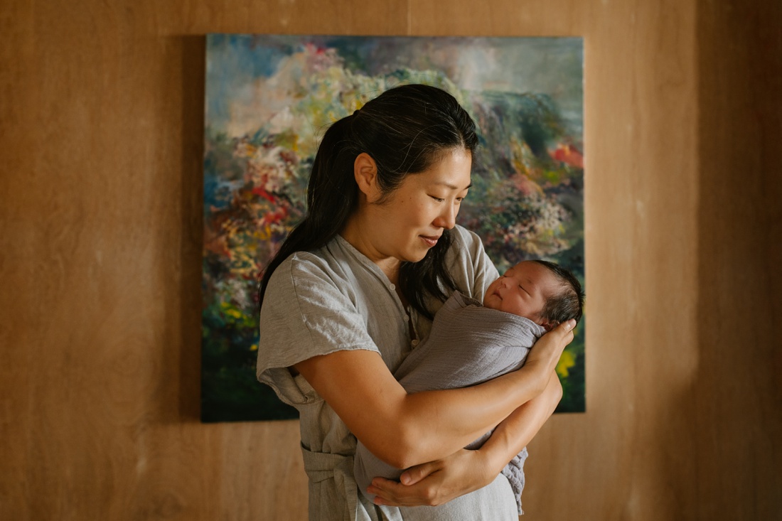 mom and new baby captured at home by newborn photographer little bird