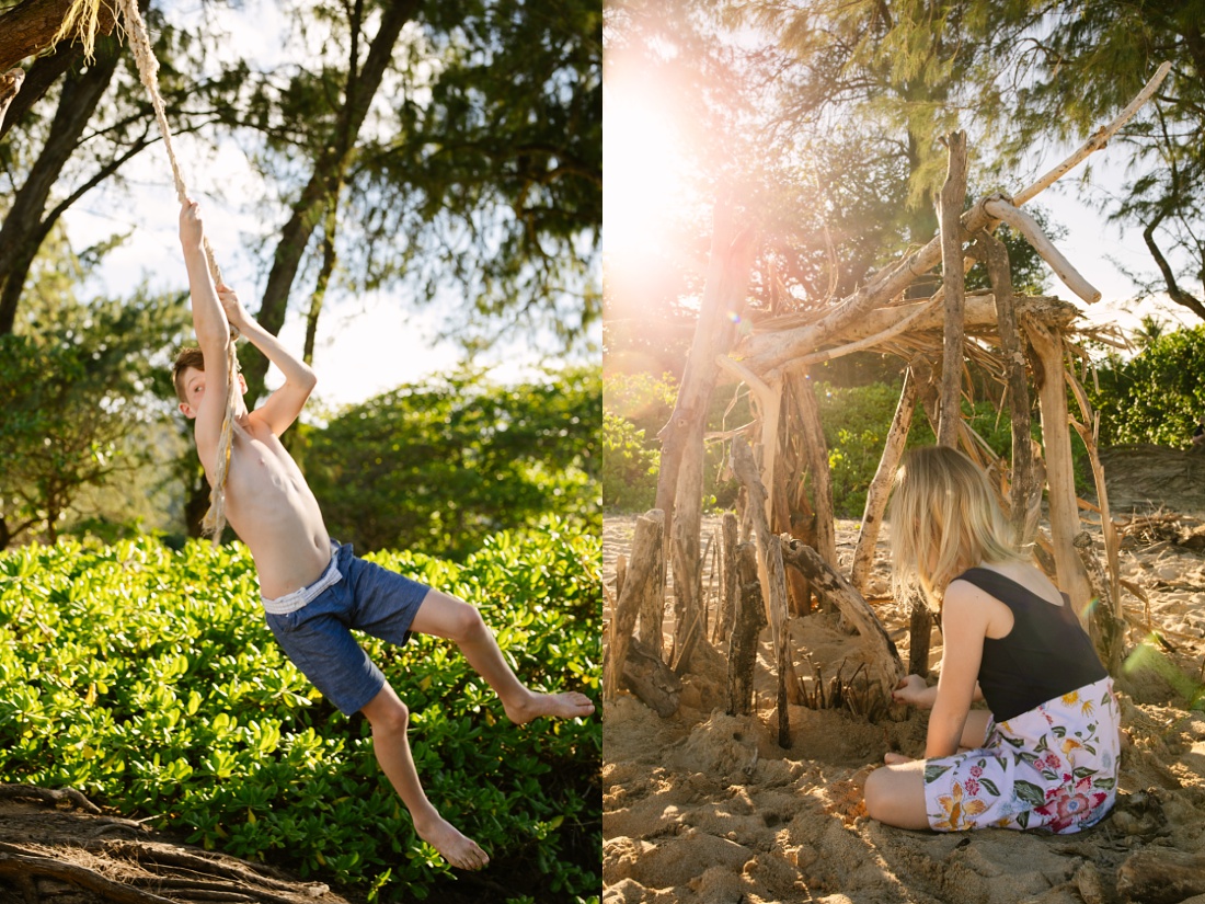 girl building a driftwood fort on the beach in hawaii during a photo session