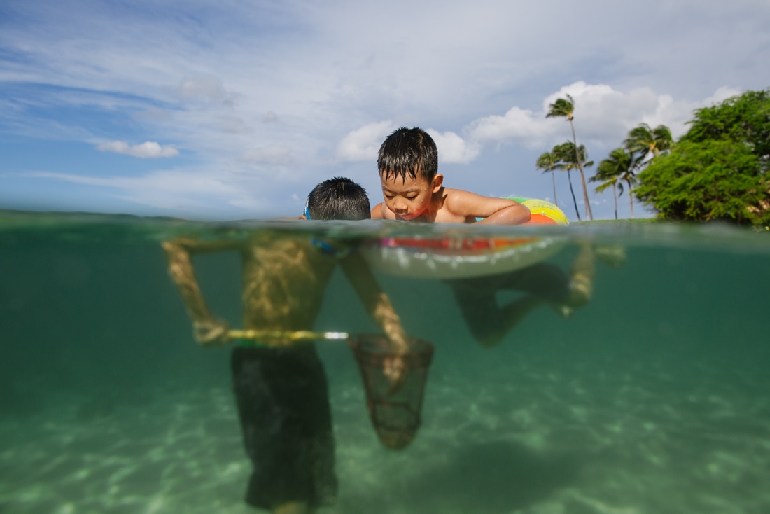 over under portrait of boys fishing in koolina lagoon oahu
