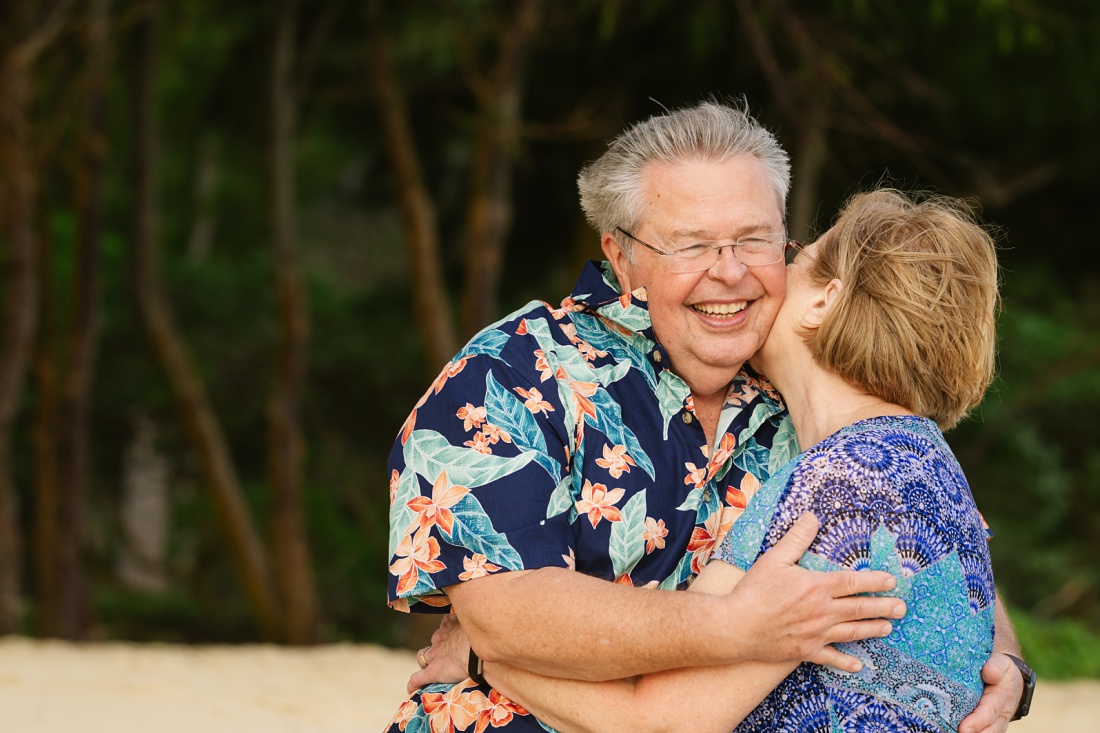 grandparents snuggle during a 50th anniversary trip to hawaii