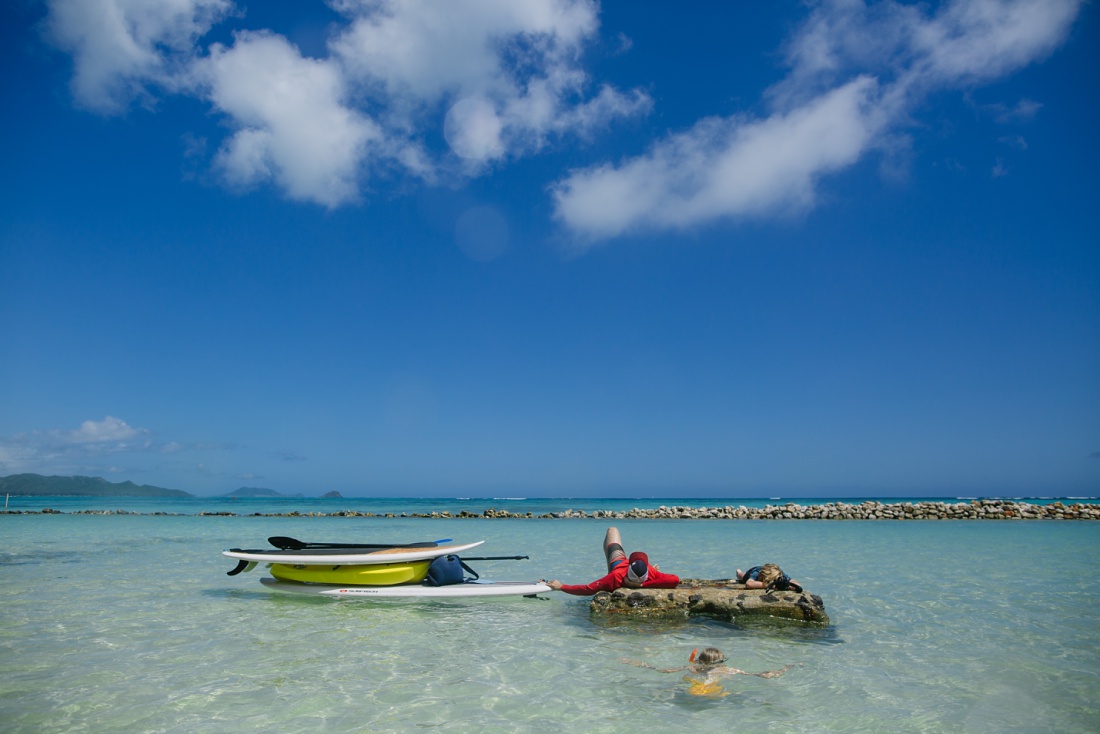 taking a paddling break at kaiona beach one of the best Family Friendly Beaches in oahu