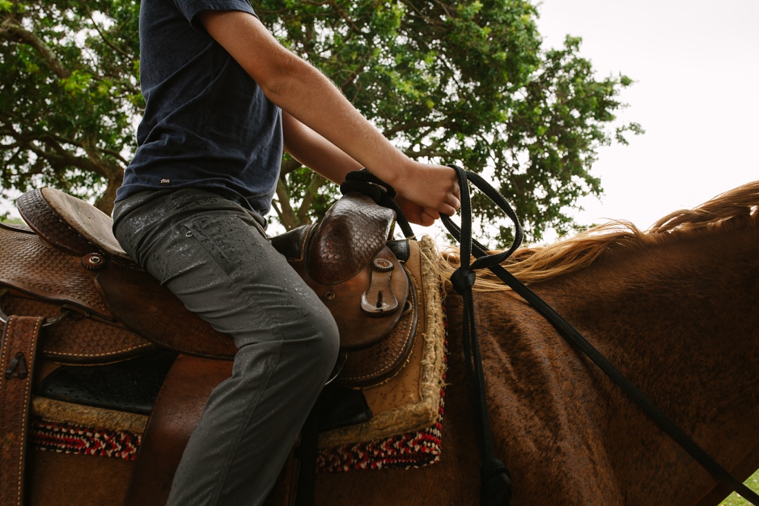 boy riding western style at gunstock ranch