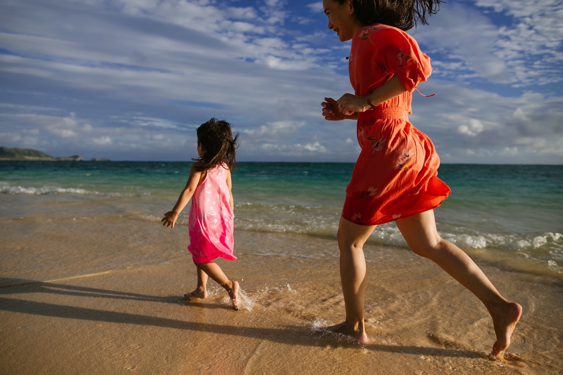 mom chasing daughter on lanikai beach in kailua