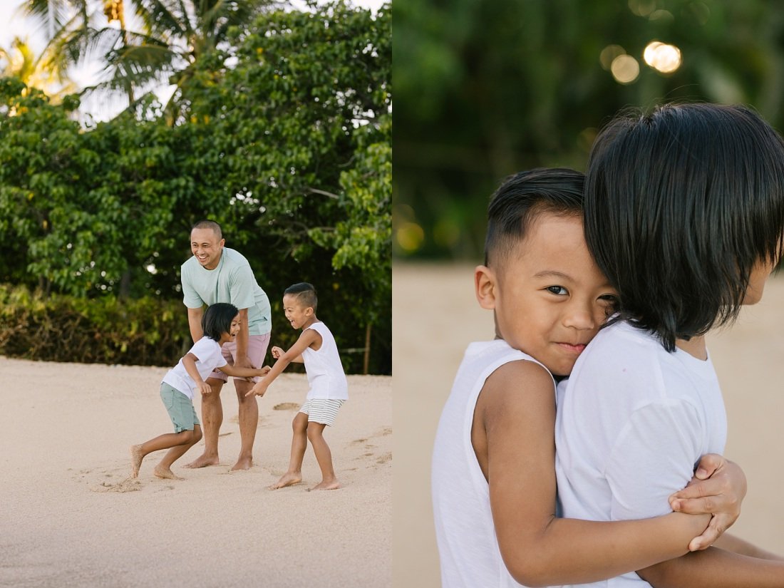 brothers playing on the beach at paradise cove koolina for family photos