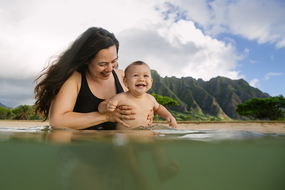 mom and baby water portrait against the mountains in oahu by little bird photography