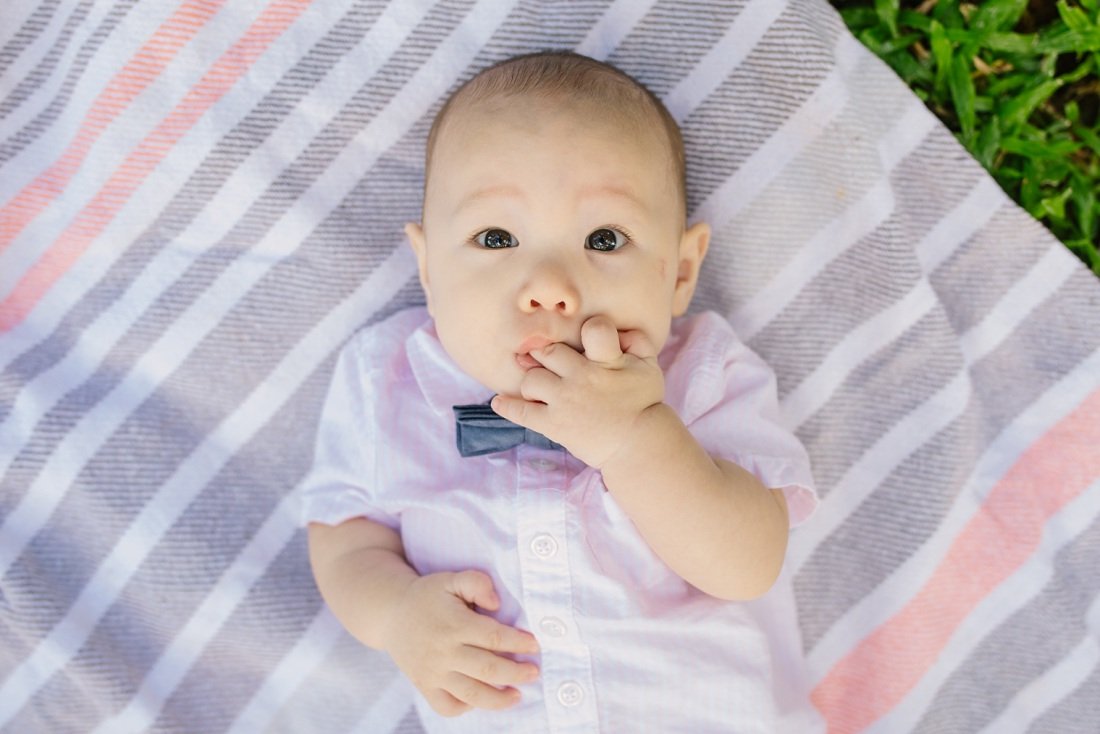 baby portrait on a blanket at the park