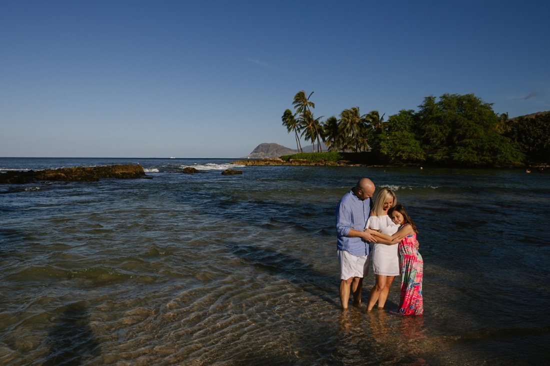 family hug at paradise cove lagoon in koolina oahu