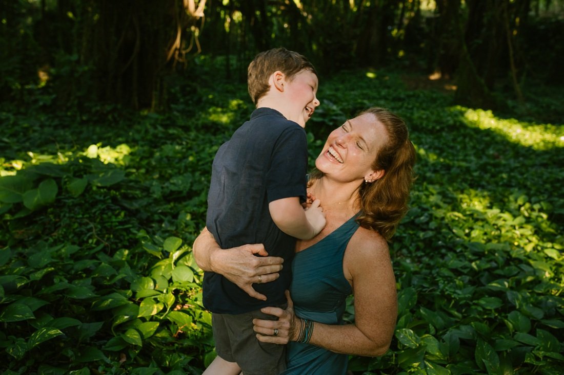 mom and son share laughs during a family portrait session in Maui