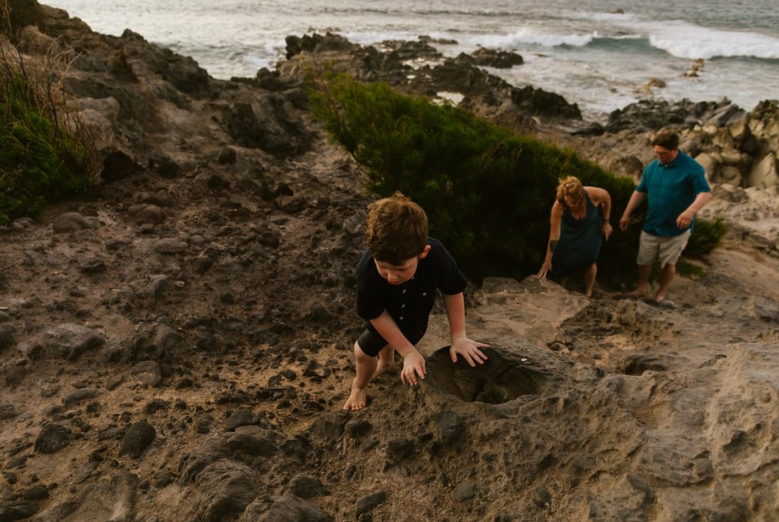 family explores the cliffs at ironwoods beach kapalua maui