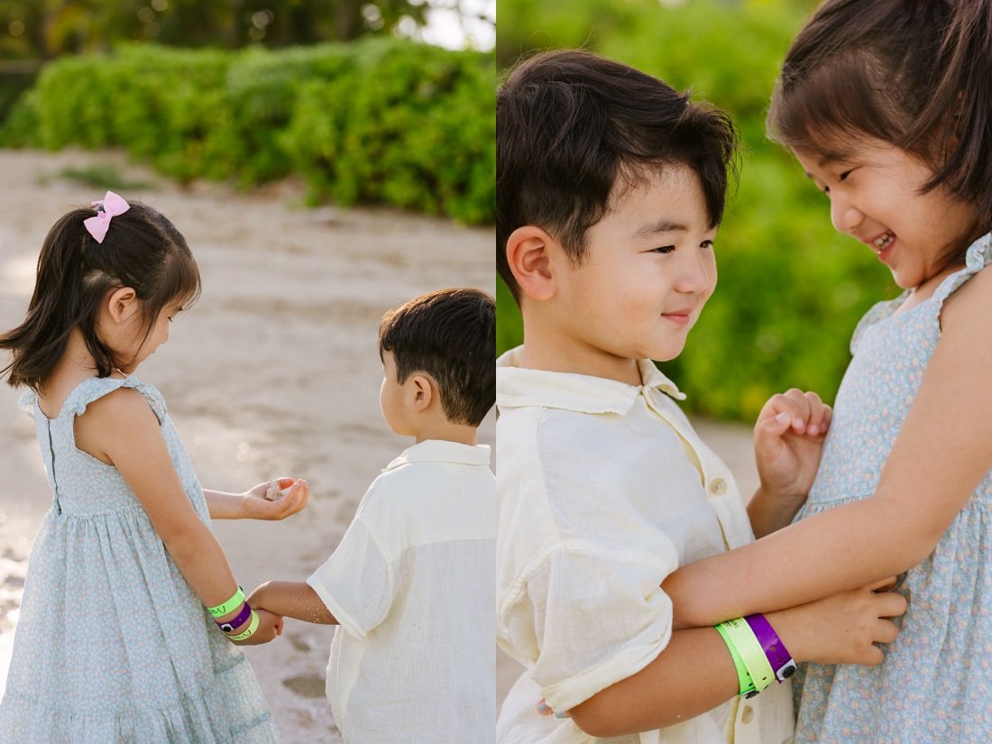 siblings share a sweet moment at the beach in oahu