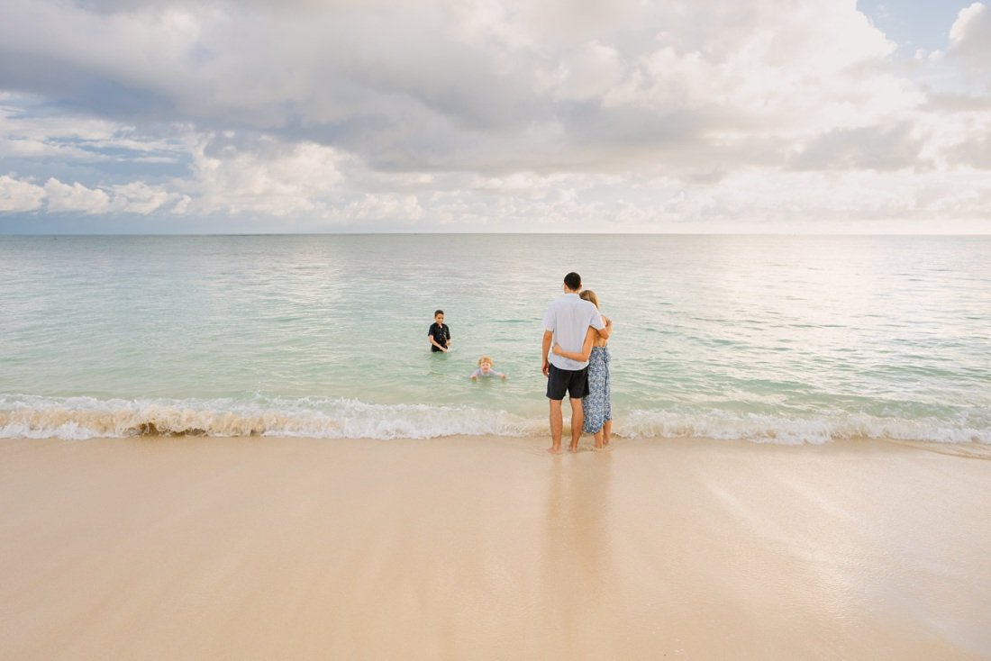 parents watching kids play in the water at lanikai beach