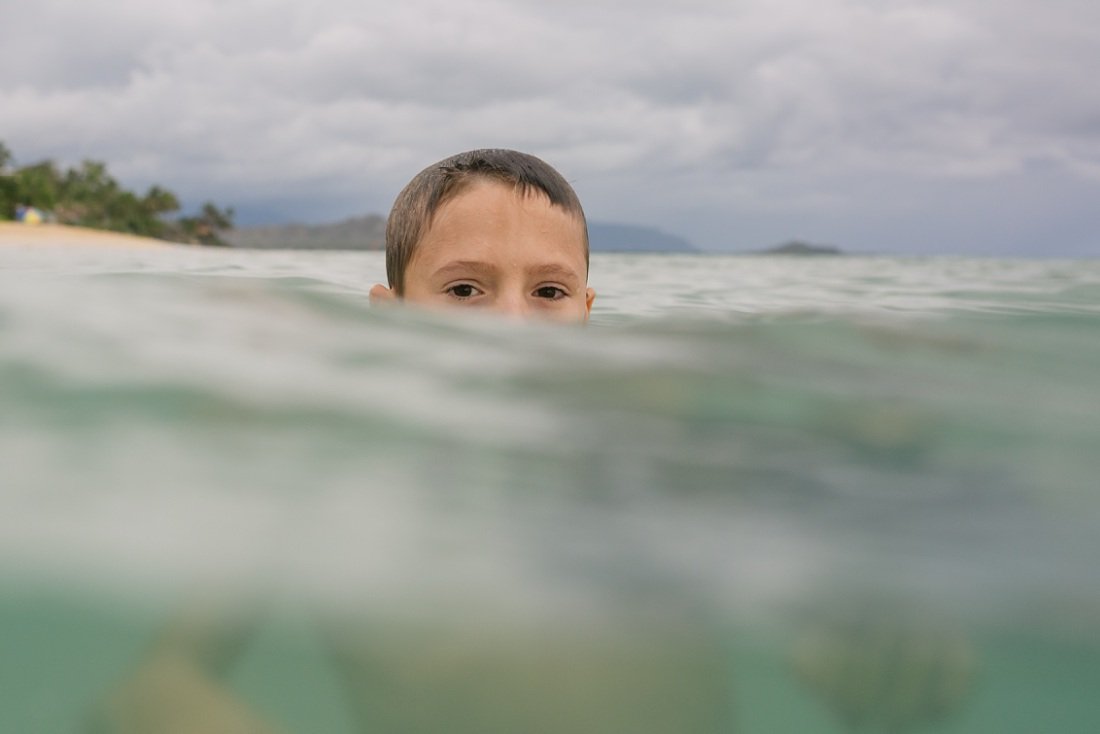 underwater portrait of a boy swimming at lanikai beach oahu