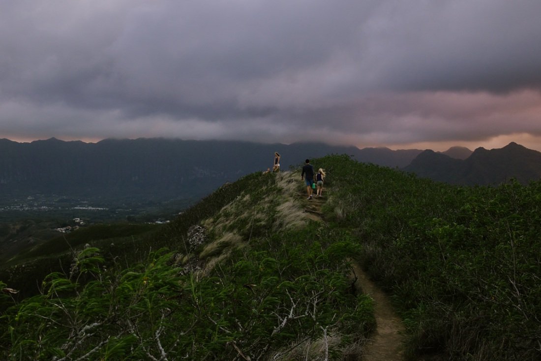 family hikes along the lanikai pillbox trail at sunset