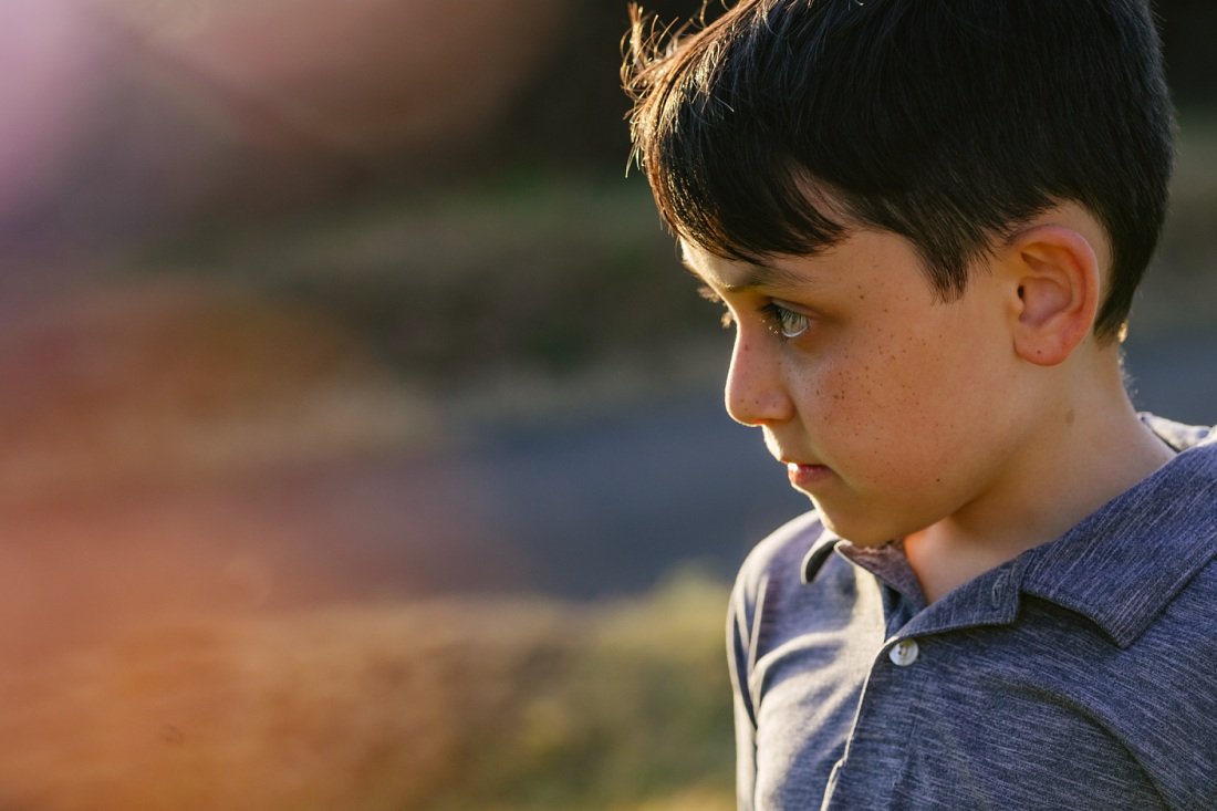 colorful portrait of a boy at sunset