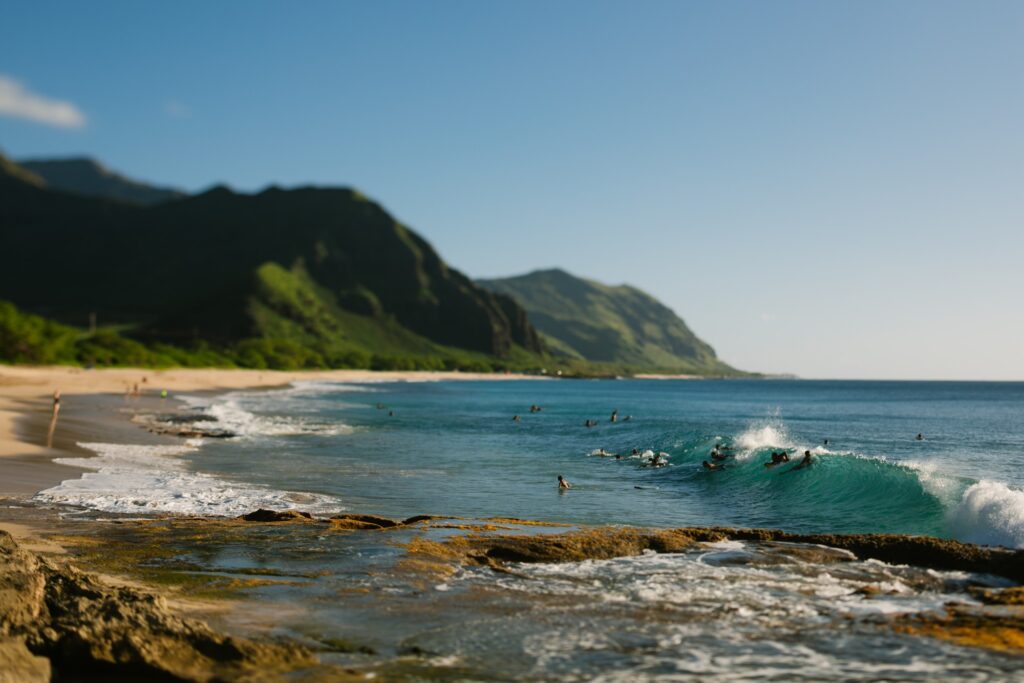 bodyboarders surfing a wave at makua beach oahu