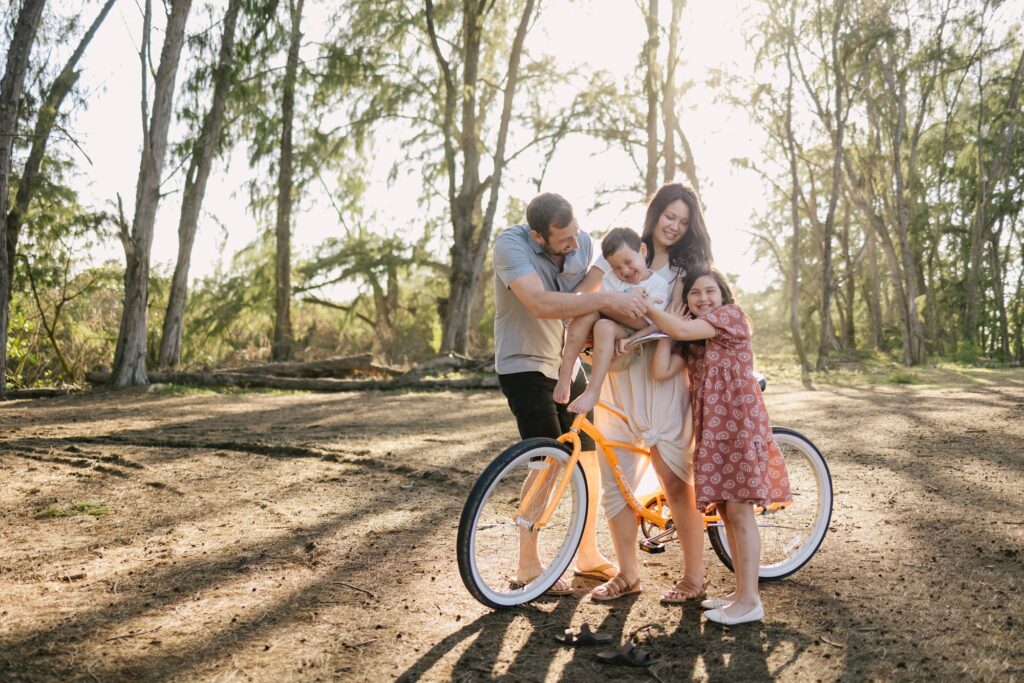 family portrait on a bike at turtle bay oahu