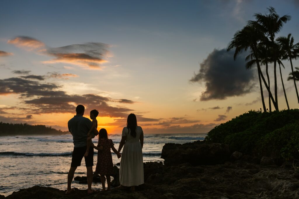 family watching a turtle bay sunset